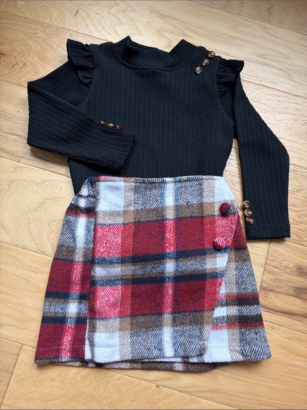 Girls Black Ruffle Shoulder Knit Top and Red Plaid Skirt Set